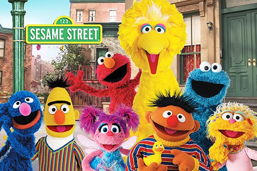 The Sesame Street characters, from the left: Grover, Bert, Abby Cadabby, Ernie, Kami, Elmo, Big Bird, the Cookie Monster.