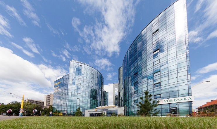 The external facade of Visma's technology center on a sunny day in Slovakia.